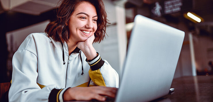 woman uses live chat to engage with a business online after hours